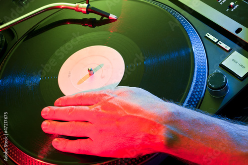 DJ hand scratches vinyl