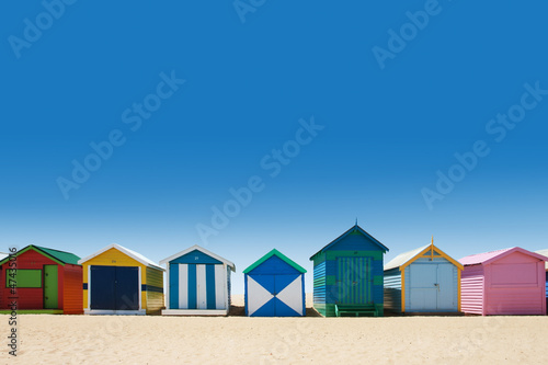Beautiful bathing houses on white sand beach