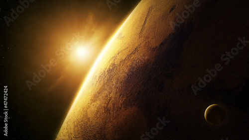 Planet Mars close-up with sunrise in space