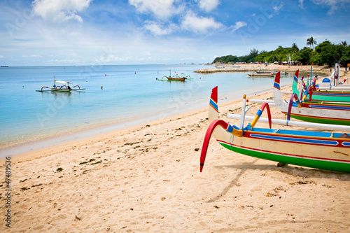 Traditional fishing boats on a beach in Nusa Dua on Bali.