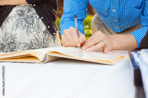 Signing a Guestbook