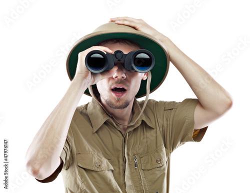 Amazed explorer looking through binoculars