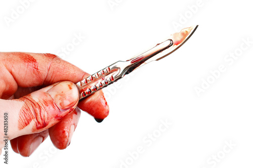 Bloody surgeon scalpel and hand , isolated