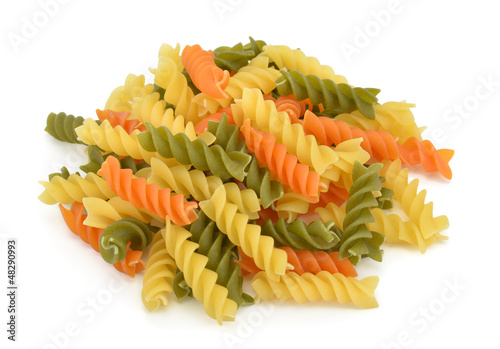 Heap of fusilli pasta isolated on white background