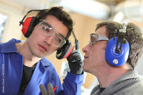 Men wearing ear defenders