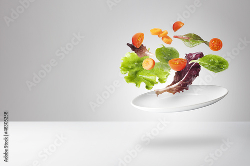 light salad with floating vegetables