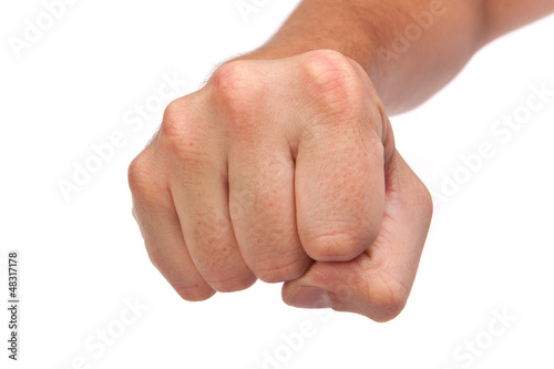 Males hand with a clenched fist isolated