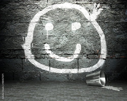 Graffiti wall with smile face, street background