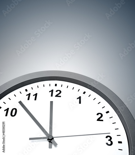 Closeup of clock on grey background
