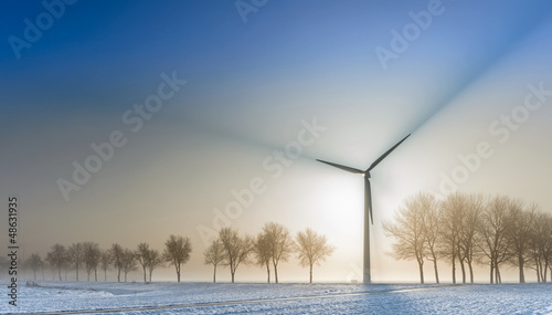 Spectacular beams of shadow from a wind turbine