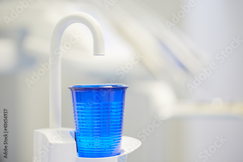 Cup of water in the dentist office.