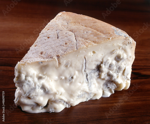 A wedge of gorgonzola cheese