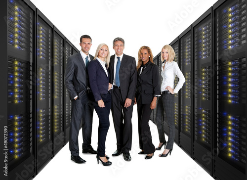 Businessteam standing on front of server racks