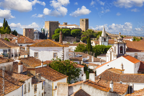  Roofs and castle of Obidos, a medieval town in Portugal