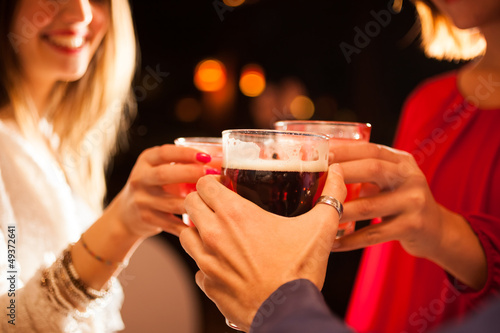 Friends having a round of drinks