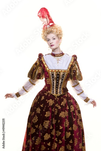 Haughty queen in royal dress isolated on white