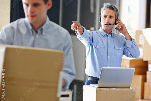 Manager Using Headset In Distribution Warehouse