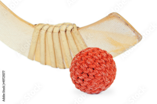 Hockey stick and wicker ball