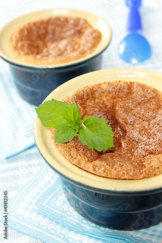 souffle garnished with fresh oranges mint leaf