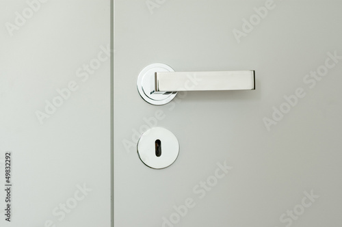 detail of white doors with chrome handle