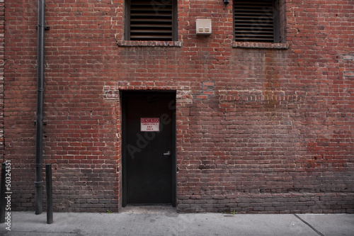 Alley Entrance backside of Brick Building