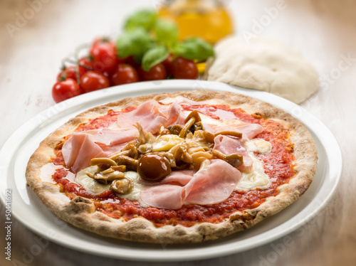 pizza with ham and mushroom, selective focus