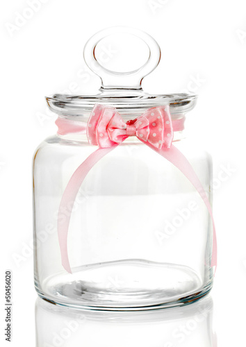 Glass jar with pink bow isolated on white