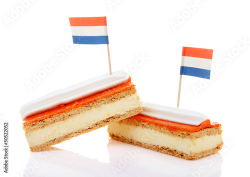 Traditional Dutch pastry called tompouce with flags