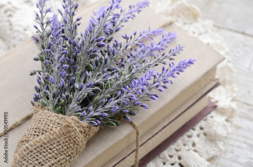 Bunch of lavender placed on book bundle