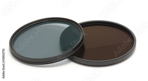 Neutral density and polarizing filters on a white background.