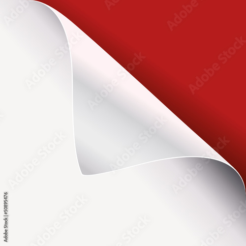 white paper curled corner on red page