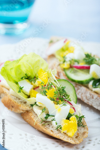 Sandwiches wit egg, lettuce, radish and cucumber