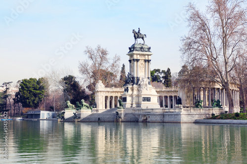 Equestrian monument to Alfonso XII reflected in pond