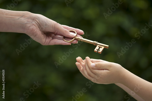 adult hands key to child