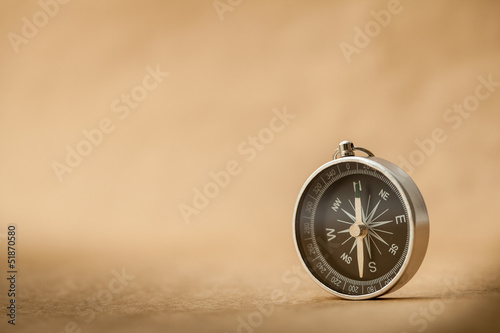 Compass on Light Brown Background