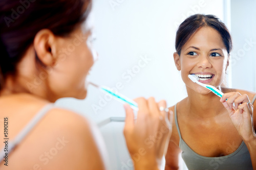 woman brushing teeth