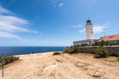 Tourists visiting Formentera La Mota lighthouse mediterranean Se
