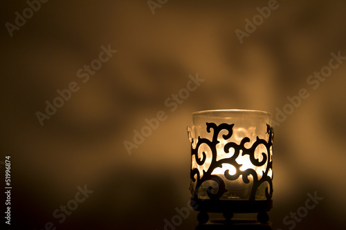 Jar candle holder on a golden background