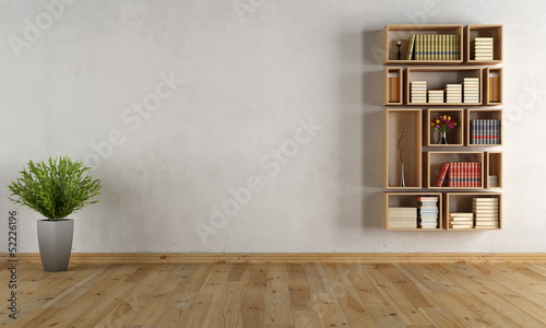 Empty interior with wall bookcase