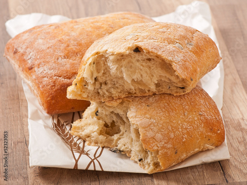 ciabatta with cheese on a wooden table 