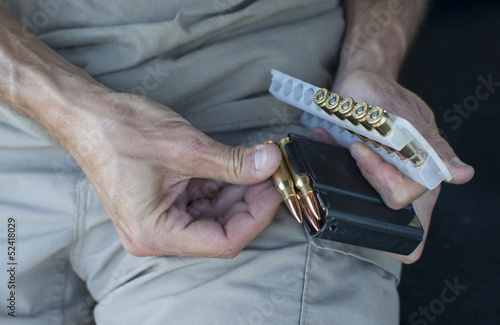 loading ammunition into a rifle clip