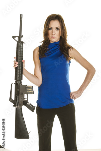 Attractive young woman with assault rifle