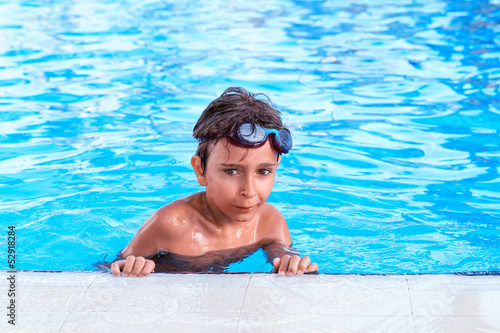 Portrait of the boy in the pool