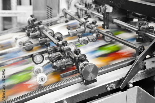 Close up of an offset printing machine during production