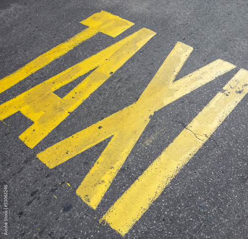 Taxi sign on street