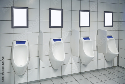 modern restroom interior with urinal row