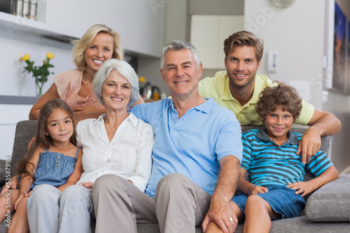 Multi-generation family posing in the living room