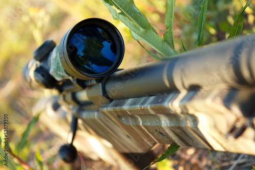 Bolt action sniper rifle with telescopic sight closeup