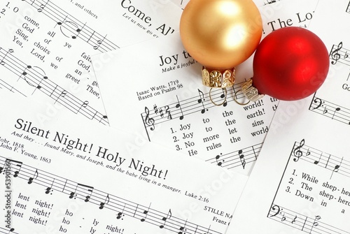 Music notes with Christmas carol and Christmas ornaments