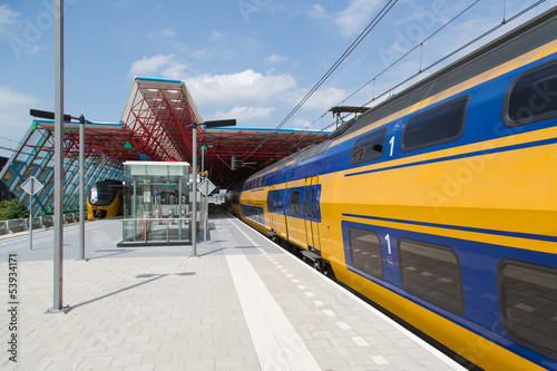 A train is leaving the central station of Lelystad, the Netherla